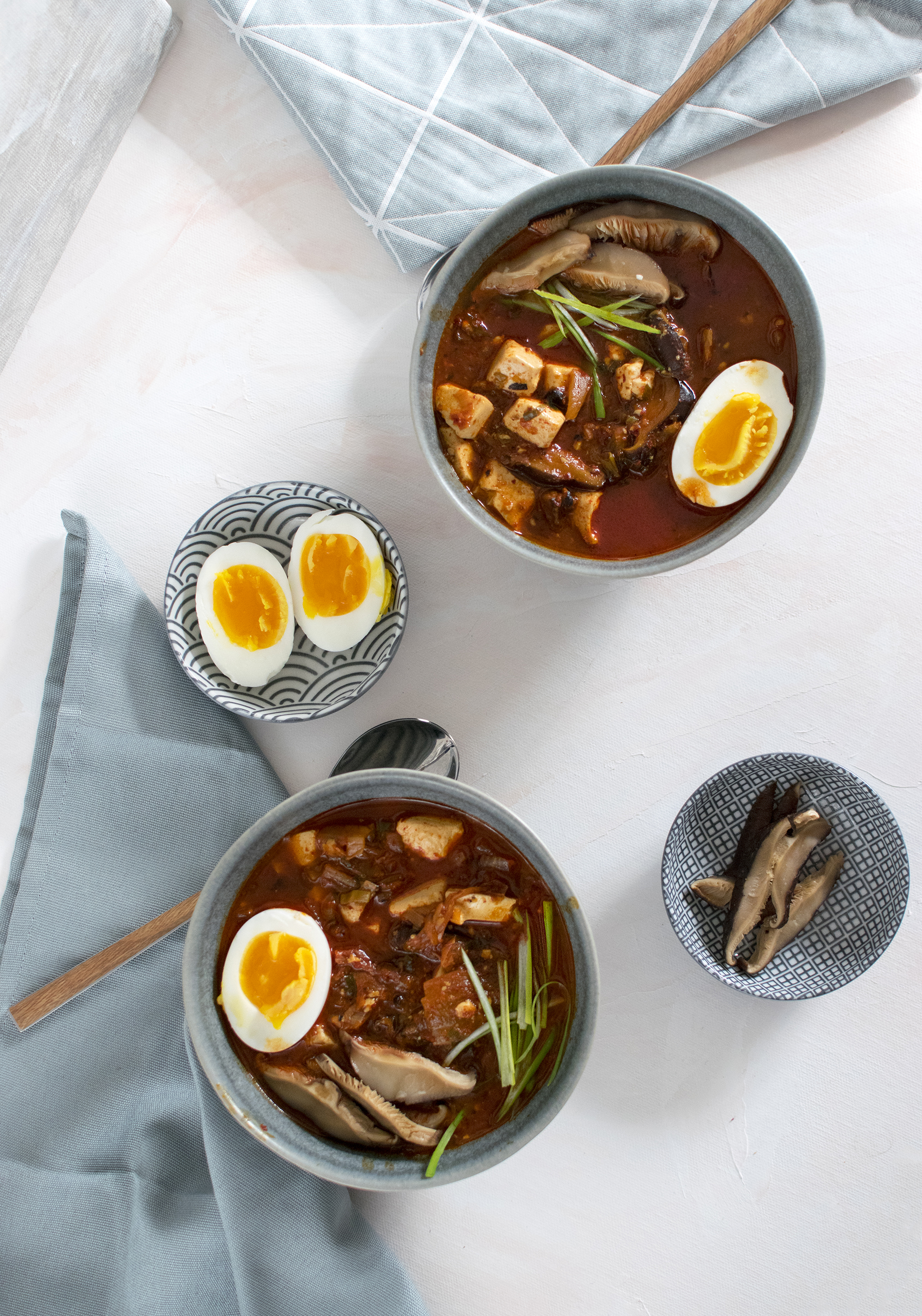 Kimchi stew with soft boiled egg, pork, tofu and shiitake mushrooms.